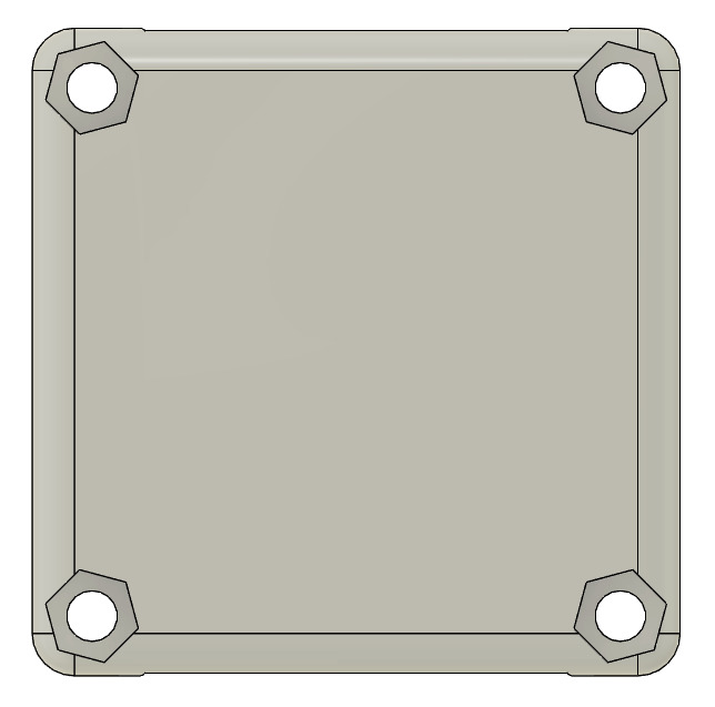 Une vue du dessous de la pièce, ou l'on peut voir les 4 trous avec une empreinte hexagonales pour les écrous.