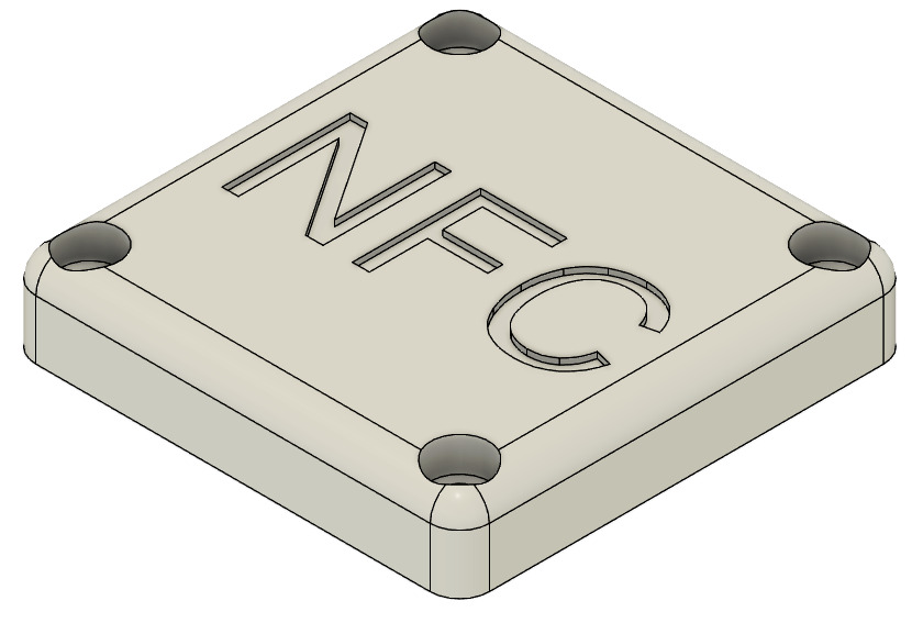 Une vue du dessus de la partie supérieure. On voit l'inscription "NFC" ainsi que les 4 trous de vis.