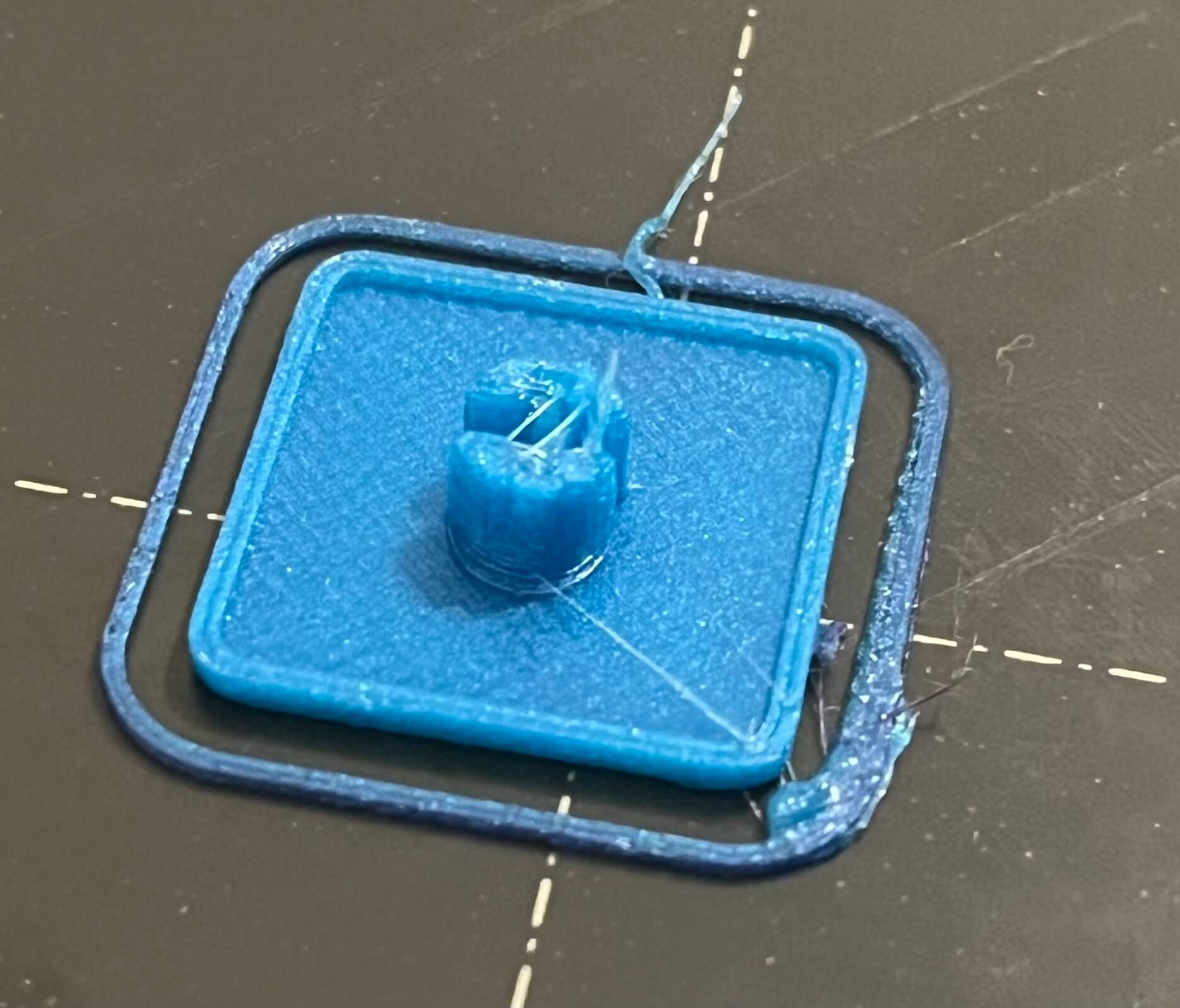 It's a blue keycap. Still on the printer bed.